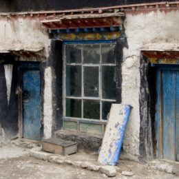 "Blue Doors" in Shigatse, Tibet. A house along the side of the road.