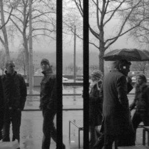 A photo taken inside a cafe and behind sliding glass doors.
