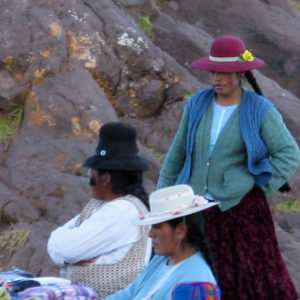 Women of Sillustani. Beautiful, age-defying, black hair similar to Tibetan women. Peruvian women dressed in stylish layered clothing also similar to Tibetan women; however, not quite the same style nor vibrancy in colors.